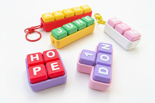 Colorful letter blocks with names and words on a white background
